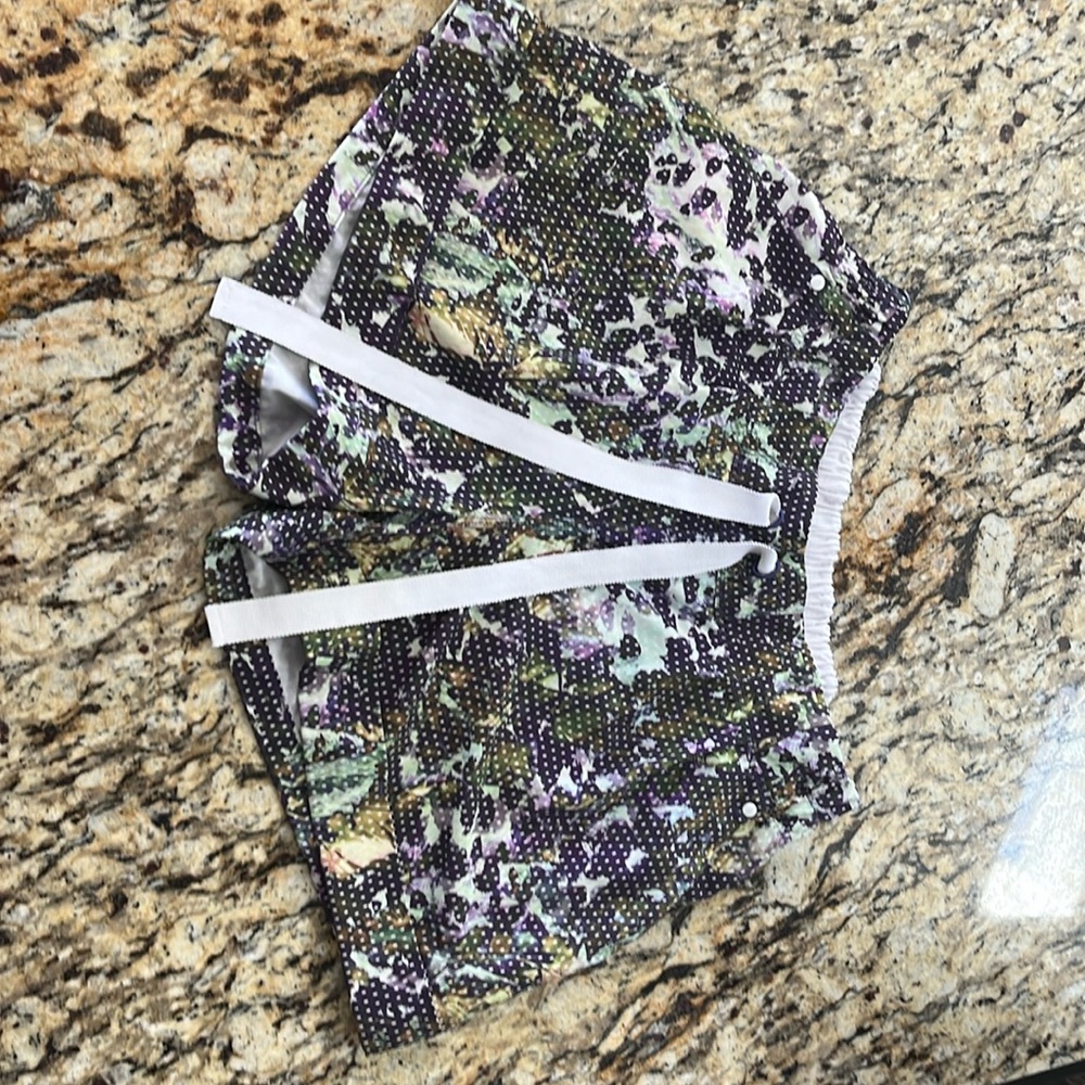 Super cute green and purple leaf patterned Lululemon shorts.